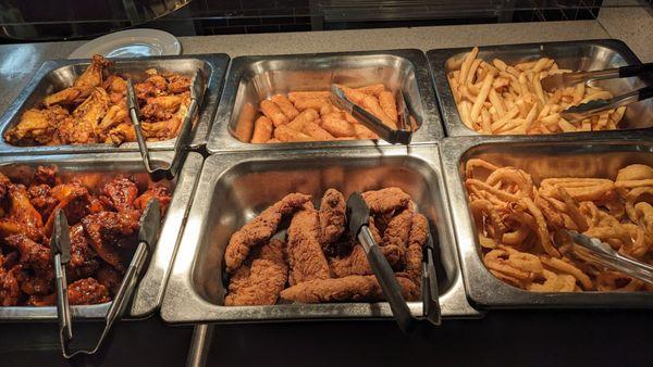 Looking very tasty! Two types of wings, chicken fingers, mozzarella sticks, fries, and onion rings!