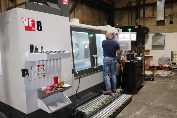 Kevin working on the Haas CNC!