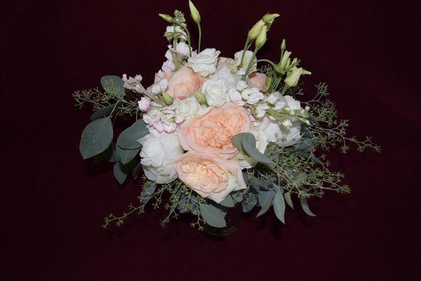 Bride's bouquet from Garden roses, lisianthus and seeded eucalyptus