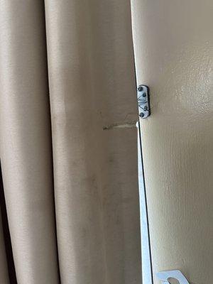 Torn curtain with stains ( blood?)