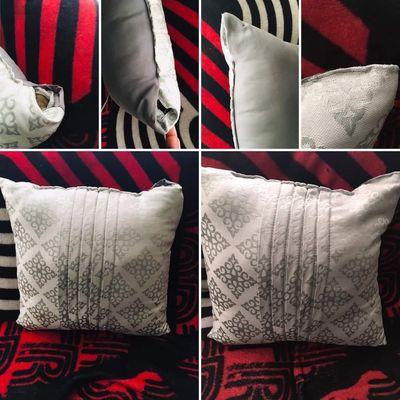 Reupholster repair on pillow with holes.