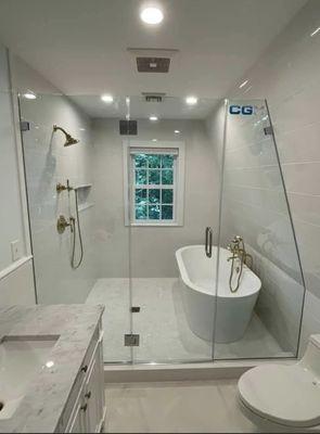 Frameless shower enclosure
