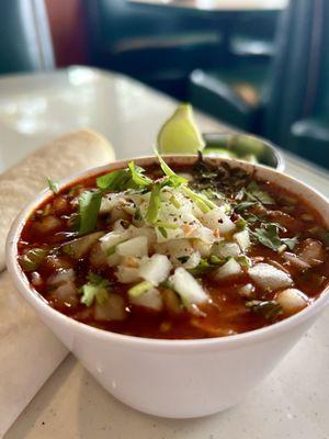 Flo's legendary menudo loaded up with fixins. This is the "cup" size (the smallest). "Small bowl" and "large bowl" sizes are also available.