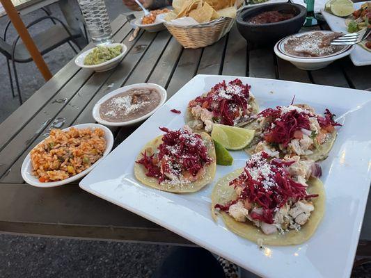 Pollo dinner with refried beans and rice