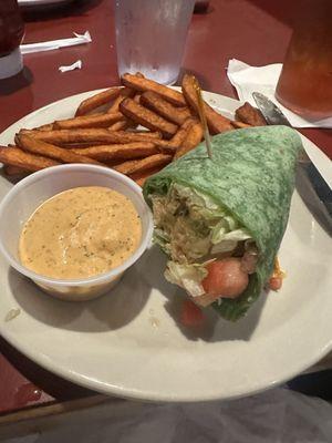 Crab cake sandwich as a wrap with their special sauce and sweet potato fries. SO GOOD!