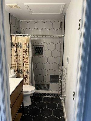 Complete bathroom remodel, all new tile, new vanity, new toilet, shower with bench and nicho, freshly painted