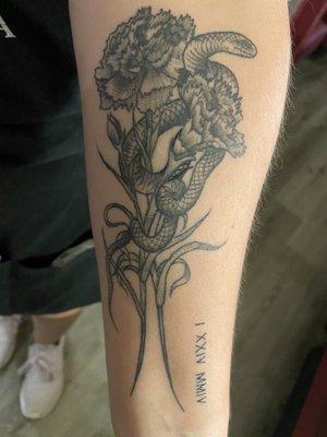 Carnation tattoo with birthdate and snake.