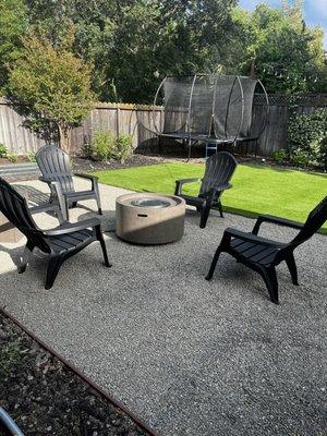Turf and pea gravel patio with fire pit