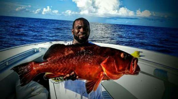 Snapper Mike with a red grouper.