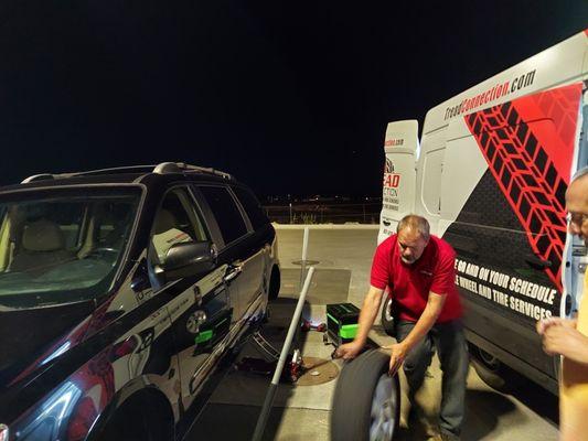 Helping a few travelers after they got a flat on the interstate.