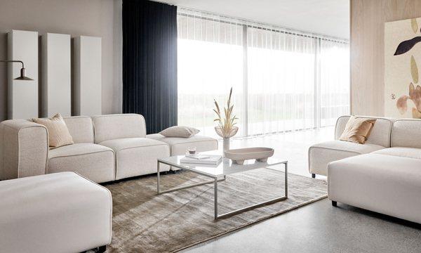 Carmo sofa in  White Lazio fabric 3090 and Cream Leeds fabric 3020, and Lugo coffee table in Ash ceramic by BoConcept