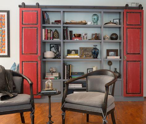 Eclectic Living Room.  Custom Shelf with decorative sliding doors.