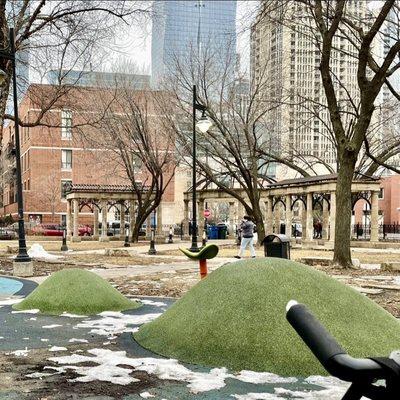 The coliseum, and what I called promenades, behind a green twirly seat