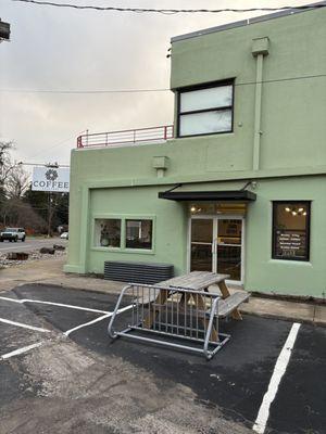 A little outside seating and a place to park your bicycle.