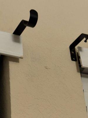 Curtain rod holders mounted