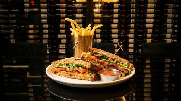 Monte Cristo Club- French toast-style sourdough bread, , powdered sugar, blackberry pepper mayo, sliced black forest ham, smoked turkey, bac