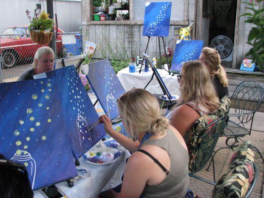 Finishing up their "Fireflies"paintings.