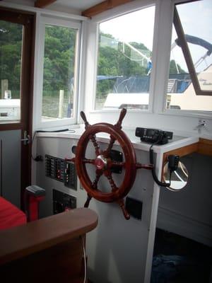 Saugatuck Wooden Boat Cruises and Tours on the Kalamazoo River at Saugatuck by Captain Christopher Carr