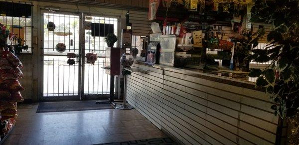 Check Out Area with a view of the steel barred door....a hint that the hood is bad.