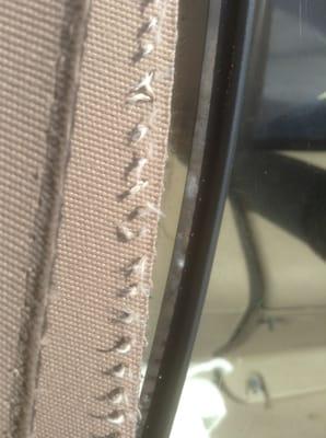 Deteriorating inferior product used for stitching in plastic Window / Top was garage kept and never taken down since installed.