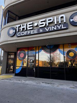 Outside of shop with the open sign off and door locked.