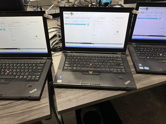 Laptops being securely wiped to NIST-800 standards.