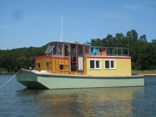 Saugatuck Wooden Boat Cruises and Tours on Kalamazoo River at Saugatuck by Captain Christopher Carr