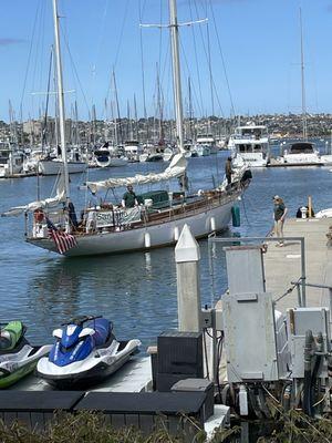 Bringing boat to marina dock for us to board.
