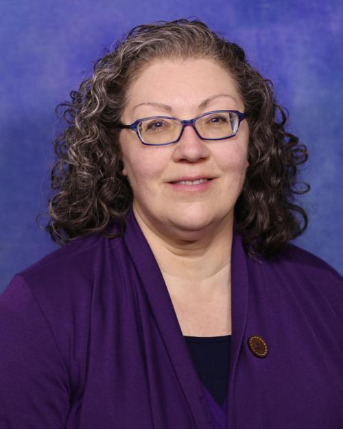 Carol L. Opheikens, FNP