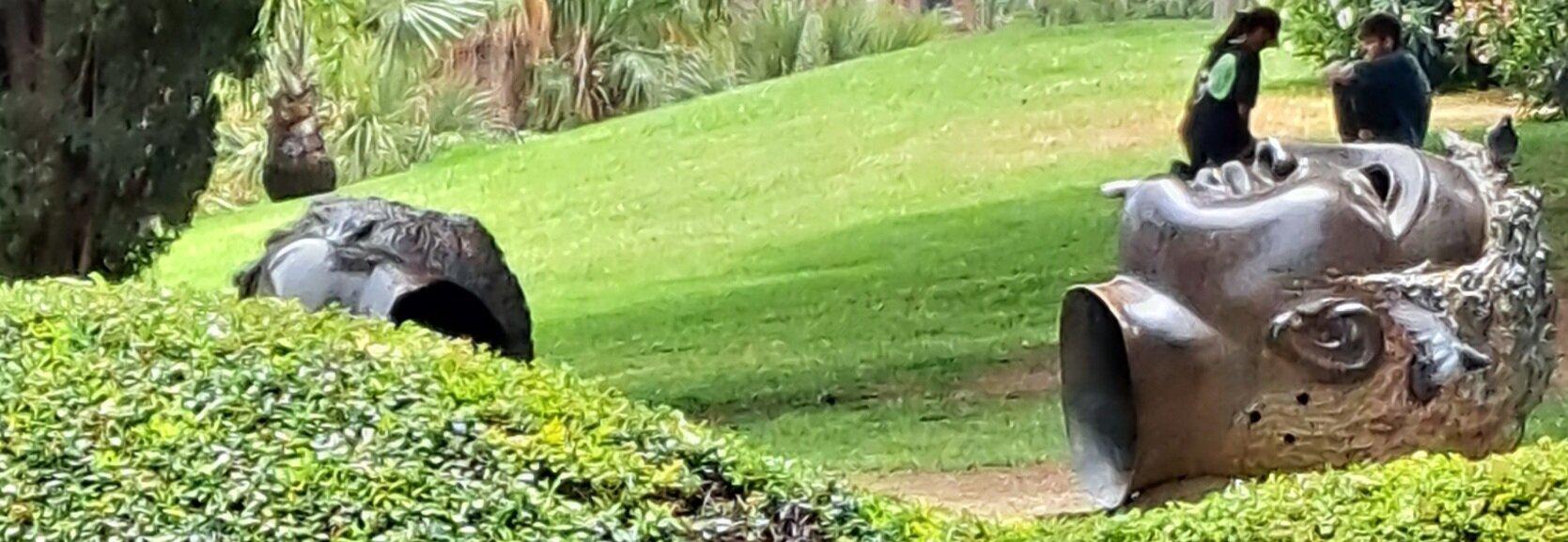 Heads On The Grass Sculpture