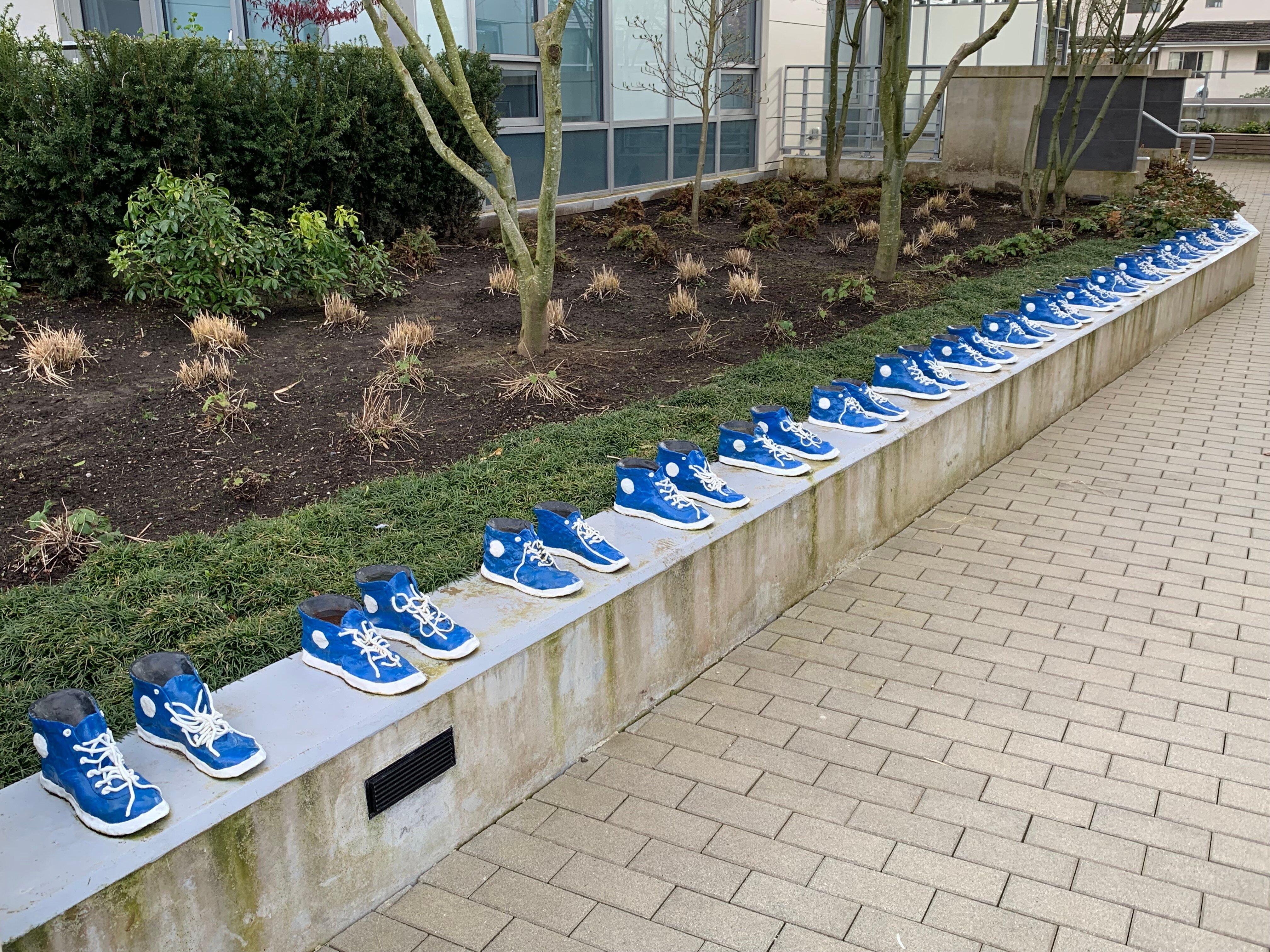 18 Pairs of Blue and White Running Shoes