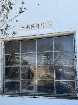 The address is on the outside of the building but is faded @ The Vintage 1970 Volkswagen 28 Foot Tall Spidermobile in Palm Springs