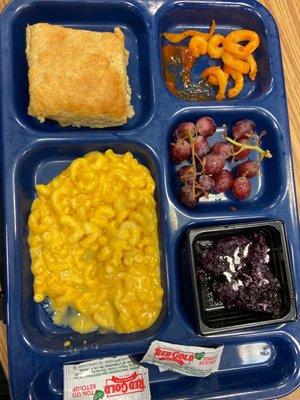 School Lunch- Macaroni and Cheese, dinner roll, grapes, curly fries and blueberry crisp