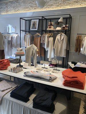 Display of sweaters and accessories.