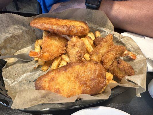 Captain's basket. Fish, shrimp, hush puppies and fries. Lots of food.