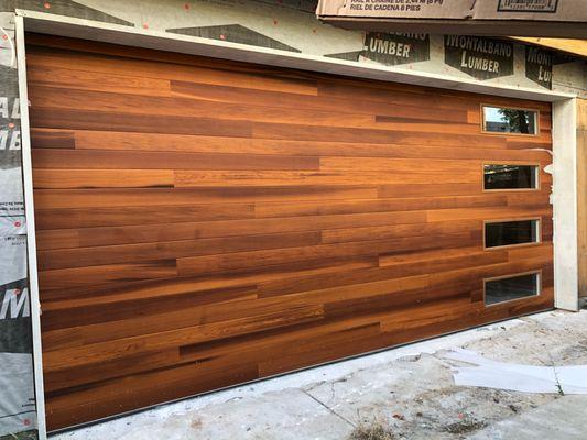 Cedar woodtone steelback insulated garage door we installed