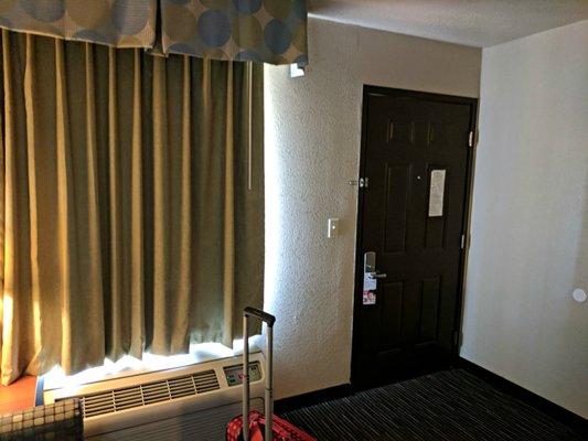 Traditional 1970's motel, dark vinyl drapes, large floor A/C until that leaked onto carpet and outside both. Ahh, the good ole days