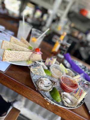 Smoked fish dip and oysters with a margarita