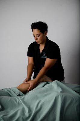 Jennifer is massaging the lower leg and calf muscle of a client.