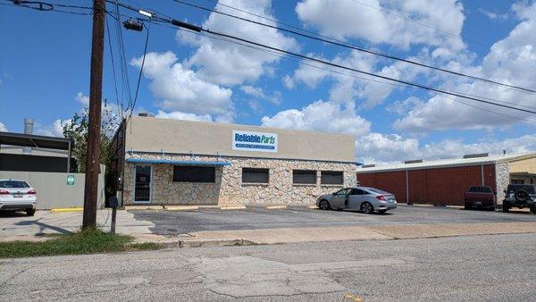 Front of the building, parking lot