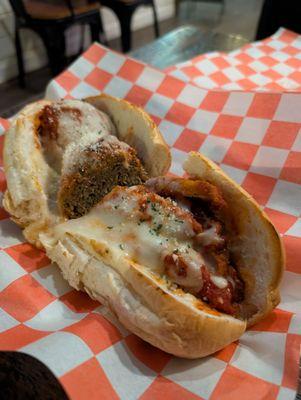 Half chicken parm, half meatball sandwiches.