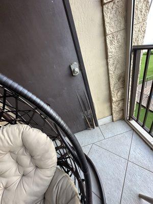 Balcony lanai. Door falling apart.