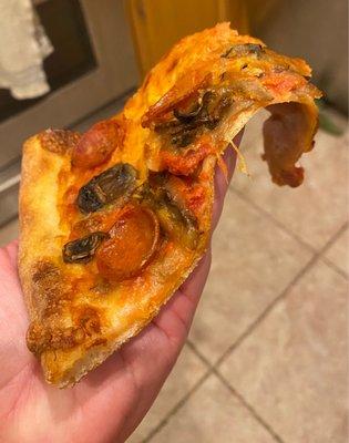Floppy pepperoni & mushroom slice.  Also don't know why it's orange?