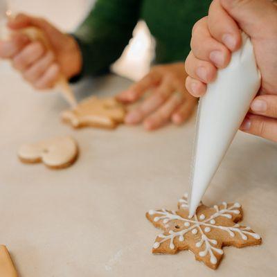For a super simple sugar cookie icing that tastes just as nice as it looks, you'll only need four ingredients: powdered sugar, milk, vanilla