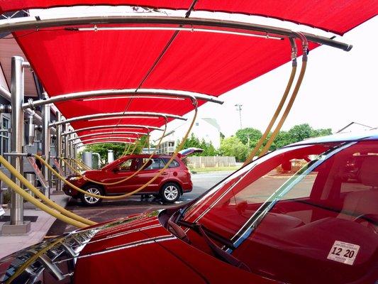 Vacuuming area has sunshades. Vacuums on either side of car for ease of use.