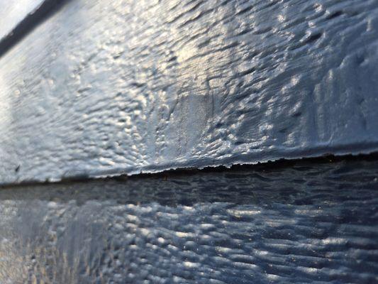 Bottom edges peopling on all sides of the home after painting.