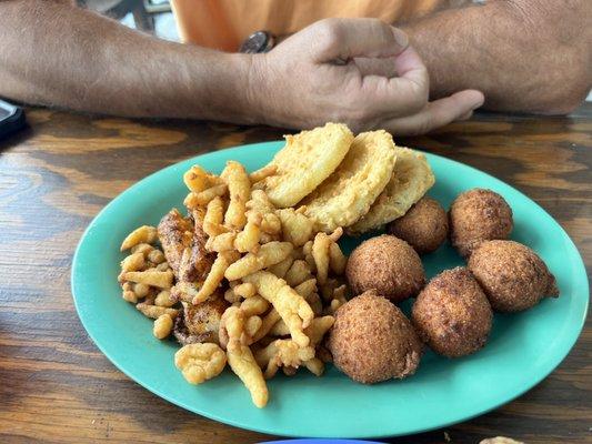 Clam strips,fried green tomatoes, grouper,hush puppies.