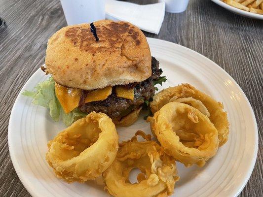 spicy BBQ bacon cheeseburger with onion rings