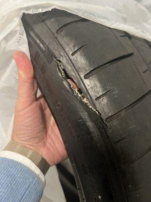 This is the "slash" that the employee stated was present when I dropped off the car. I DROVE it there with normal pressures. They damaged it