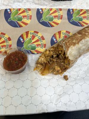 Chorizo, egg, potato, bean and cheese breakfast burrito. AMAZING red salsa!